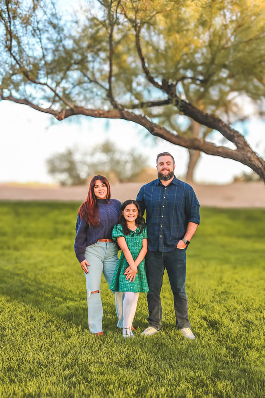 Family of four in a desert field